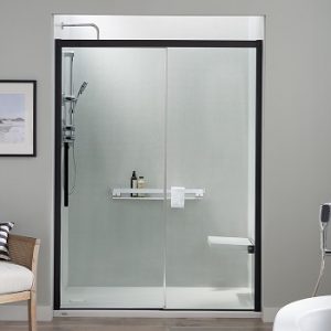 A modern walk-in shower with black-framed shower doors