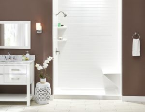 Picture of a stylish bathroom with brown walls and a white shower enclosure.